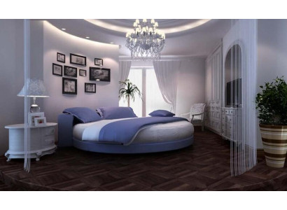 Moderne sort seng med elegante detaljer og en sofa