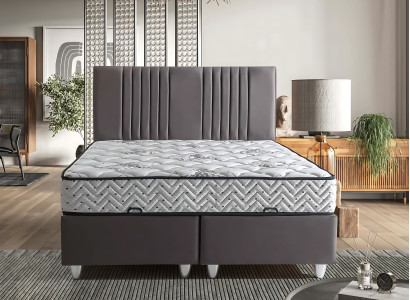 Seng i gråt materiale med moderne madras